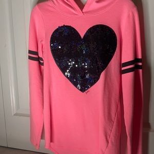 Pink sweater with a black heart